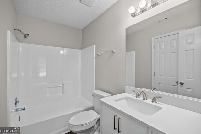 bathroom featuring toilet, a textured ceiling, visible vents, and shower / bathing tub combination