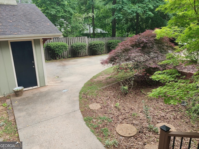 view of yard featuring a patio and fence