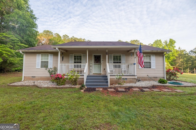 ranch-style house featuring a porch, a front lawn, and crawl space