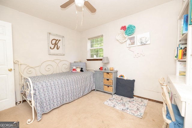 bedroom with light carpet and a ceiling fan