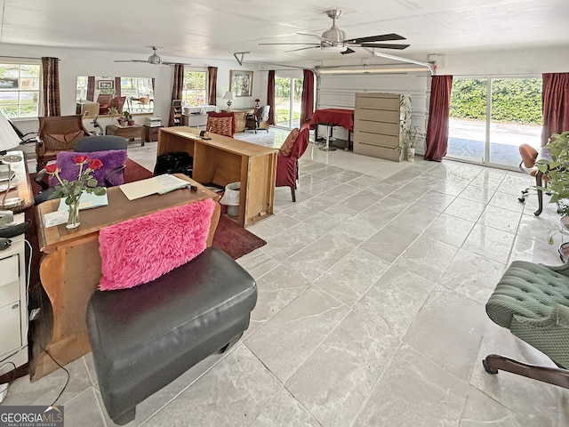 interior space featuring ceiling fan