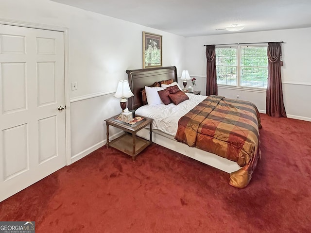 bedroom with carpet floors and baseboards