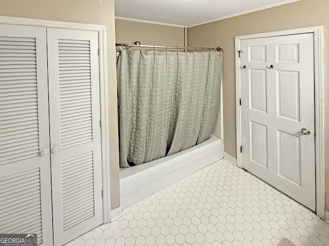 full bathroom with tile patterned floors, ornamental molding, and shower / tub combo