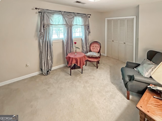 sitting room with baseboards, carpet, and visible vents