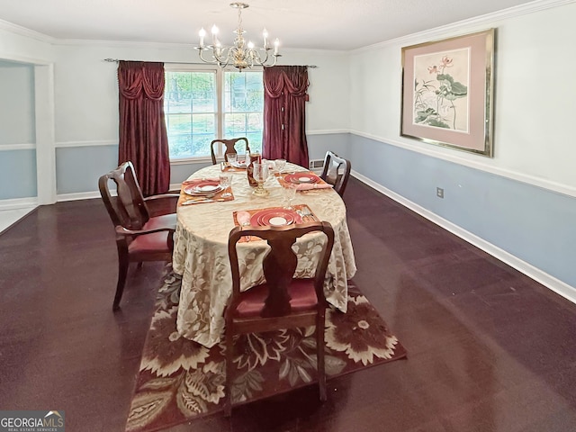 dining room featuring crown molding, baseboards, and a notable chandelier