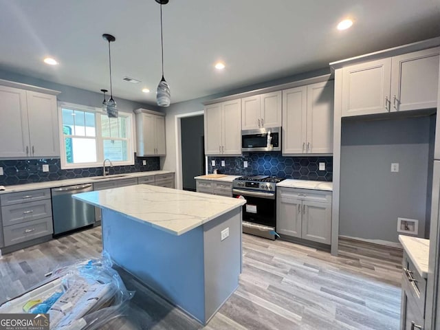154 Pope Paul Path, Dallas, GA 30132 - kitchen featuring appliances with stainless steel finishes, a sink, gray cabinets, decorative backsplash, and recessed lighting