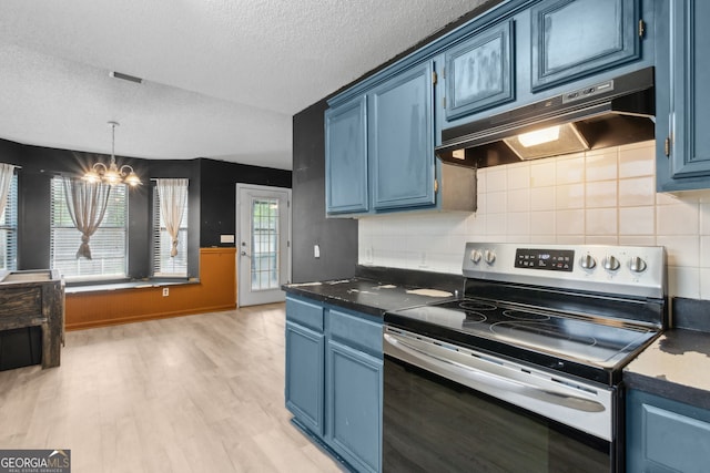 kitchen with stainless steel electric range and blue cabinets