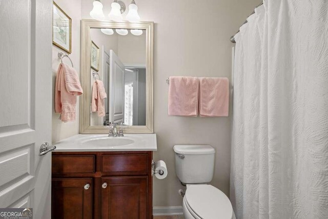 6408 Autumn Crest Ln, Hoschton, GA 30548 - full bathroom with toilet, vanity, and curtained shower