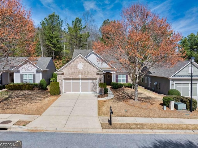 6408 Autumn Crest Ln, Hoschton, GA 30548 - view of front of property with a garage, driveway, and brick siding