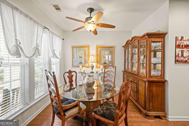 6408 Autumn Crest Ln, Hoschton, GA 30548 - dining area with ceiling fan, light wood-style floors, and baseboards