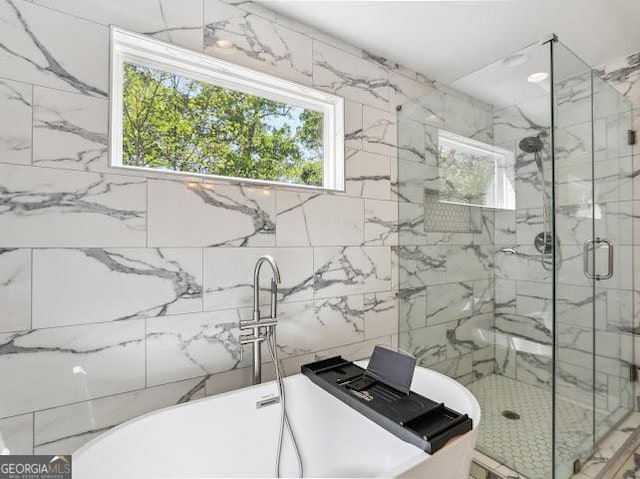 1599 Ezra Church Dr NW, Atlanta, GA 30314 - full bath featuring a freestanding tub, plenty of natural light, and a marble finish shower