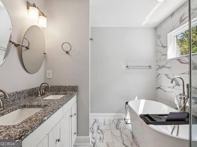 1599 Ezra Church Dr NW, Atlanta, GA 30314 - bathroom with a sink, baseboards, double vanity, and marble finish floor