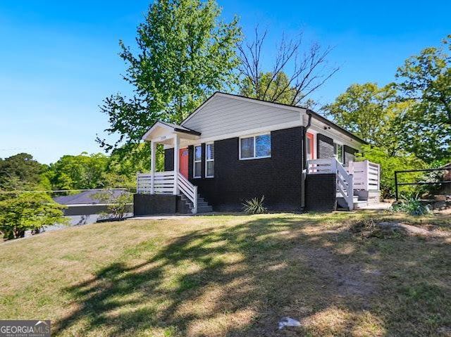 1599 Ezra Church Dr NW, Atlanta, GA 30314 - view of front of house featuring brick siding and a front lawn