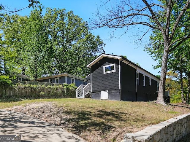 1599 Ezra Church Dr NW, Atlanta, GA 30314 - view of side of property featuring a lawn and fence
