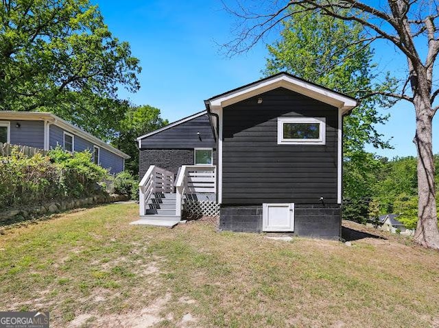 1599 Ezra Church Dr NW, Atlanta, GA 30314 - back of house with a yard and a wooden deck
