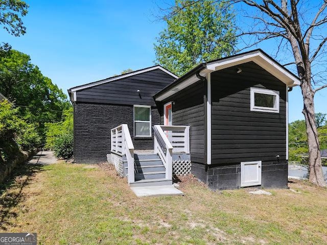 1599 Ezra Church Dr NW, Atlanta, GA 30314 - view of front facade with a deck and a front yard