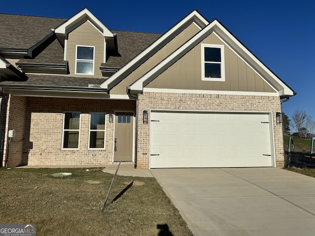 view of front facade with brick siding, board and batten siding, roof with shingles, and driveway