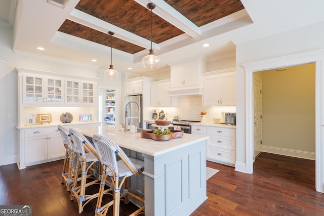 kitchen featuring a kitchen breakfast bar, recessed lighting, wooden ceiling, appliances with stainless steel finishes, and backsplash