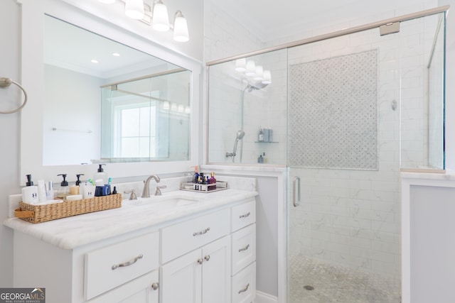 full bathroom featuring vanity, ornamental molding, and a stall shower