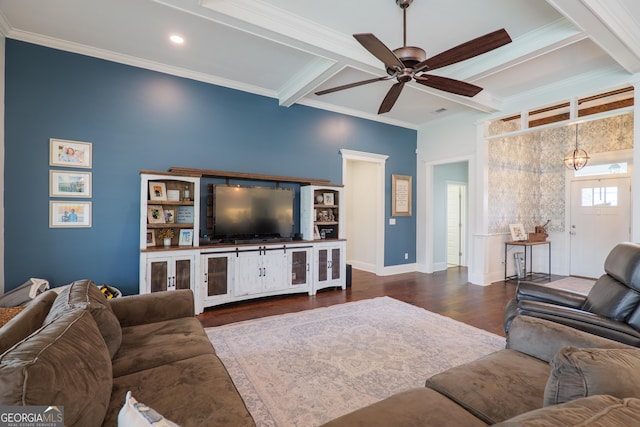 living room with ceiling fan with notable chandelier, wood finished floors, beamed ceiling, ornamental molding, and coffered ceiling