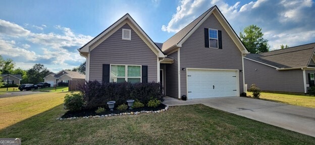 77 Willowrun Dr SW, Rome, GA 30165 - traditional-style home featuring an attached garage, concrete driveway, and a front yard