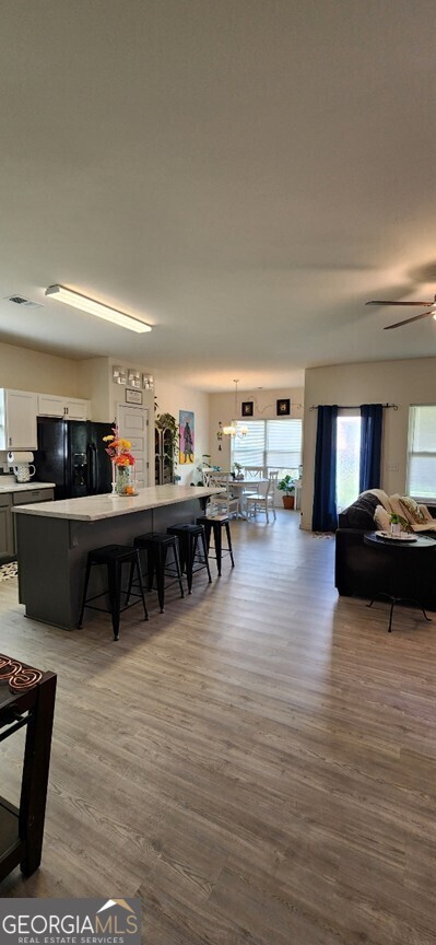 77 Willowrun Dr SW, Rome, GA 30165 - dining area with ceiling fan, a healthy amount of sunlight, and wood finished floors