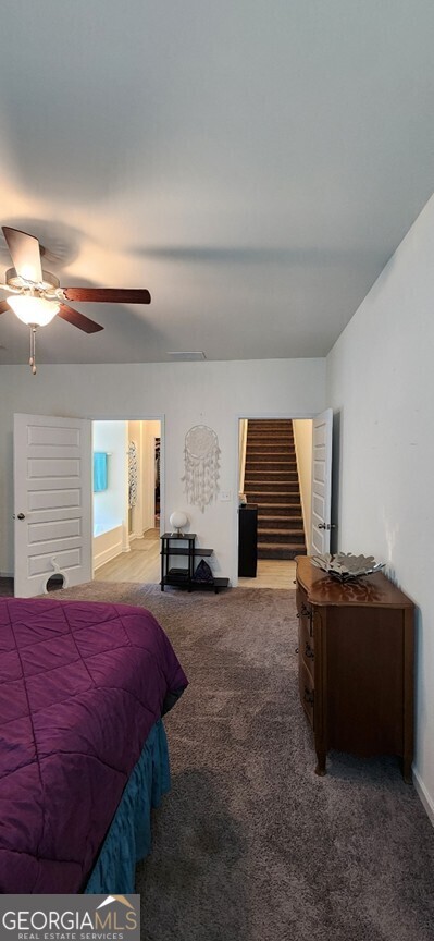 77 Willowrun Dr SW, Rome, GA 30165 - bedroom with baseboards, a ceiling fan, and carpet