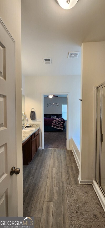 77 Willowrun Dr SW, Rome, GA 30165 - corridor featuring baseboards, dark wood-style floors, and visible vents