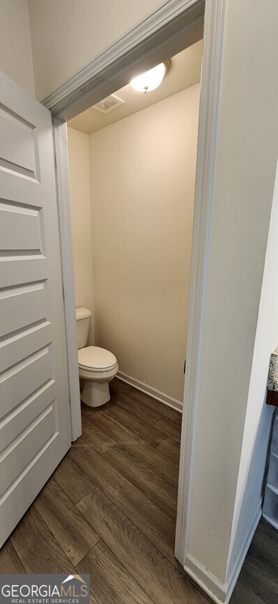 77 Willowrun Dr SW, Rome, GA 30165 - bathroom with visible vents, wood finished floors, and toilet