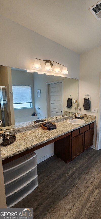 77 Willowrun Dr SW, Rome, GA 30165 - full bathroom with visible vents, an enclosed shower, wood finished floors, and vanity