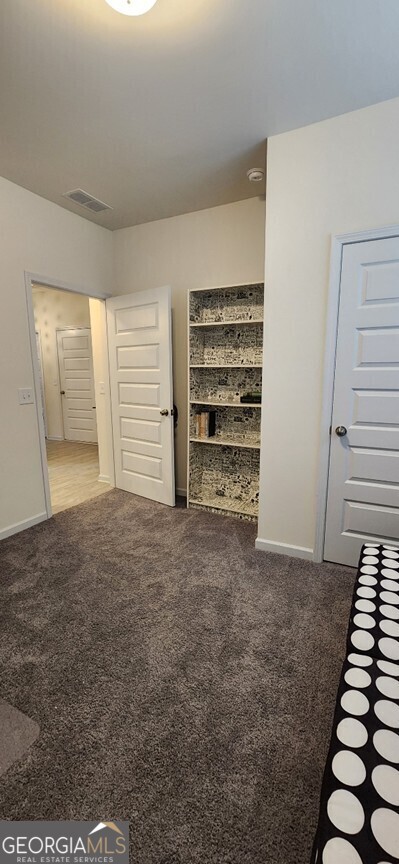 77 Willowrun Dr SW, Rome, GA 30165 - unfurnished bedroom featuring carpet floors, baseboards, and visible vents