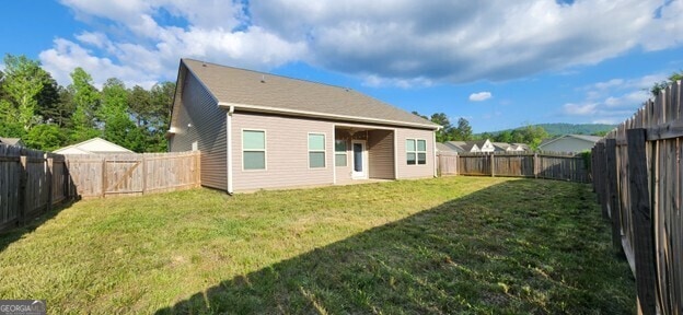77 Willowrun Dr SW, Rome, GA 30165 - rear view of property featuring a lawn and a fenced backyard