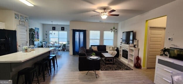 77 Willowrun Dr SW, Rome, GA 30165 - living area featuring a fireplace, a ceiling fan, and wood finished floors