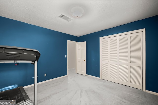 unfurnished bedroom featuring baseboards, carpet floors, and visible vents