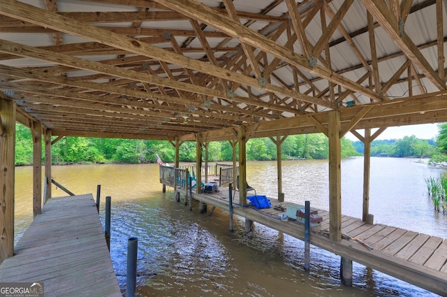 view of dock featuring a water view and boat lift
