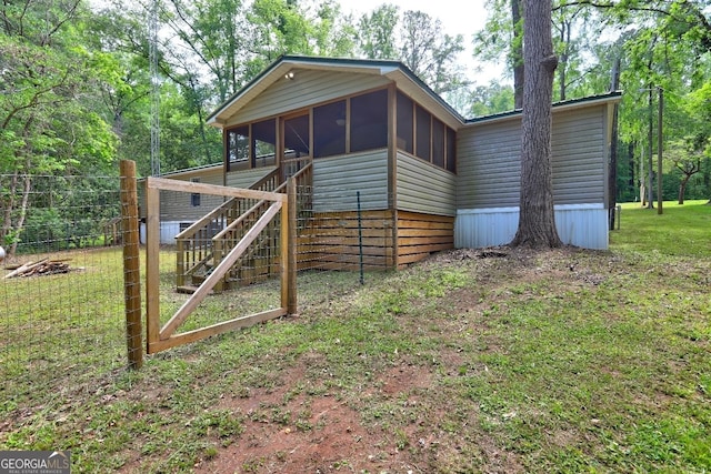 exterior space featuring a sunroom and stairway
