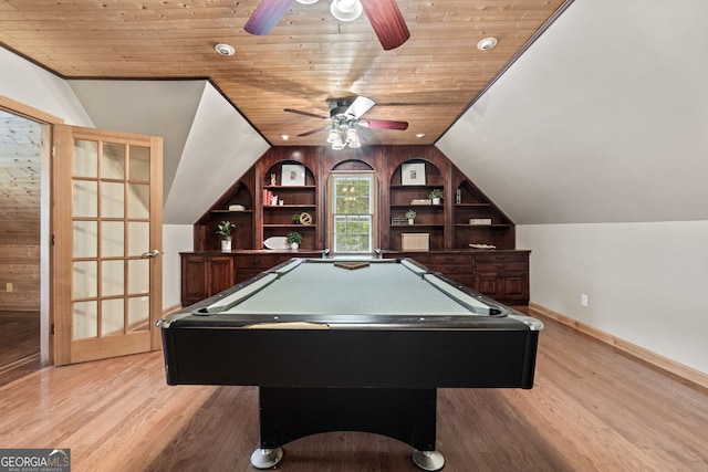 rec room featuring a ceiling fan, built in features, and light wood finished floors