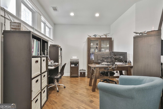 office with recessed lighting, visible vents, and light wood-style floors