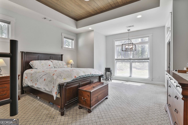 bedroom featuring wooden ceiling, visible vents, light carpet, and multiple windows