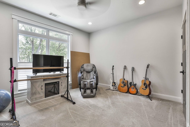 interior space with a ceiling fan, visible vents, recessed lighting, and carpet