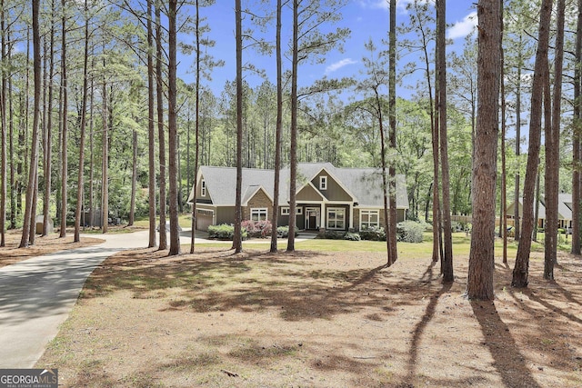 view of front of home featuring concrete driveway and an attached garage