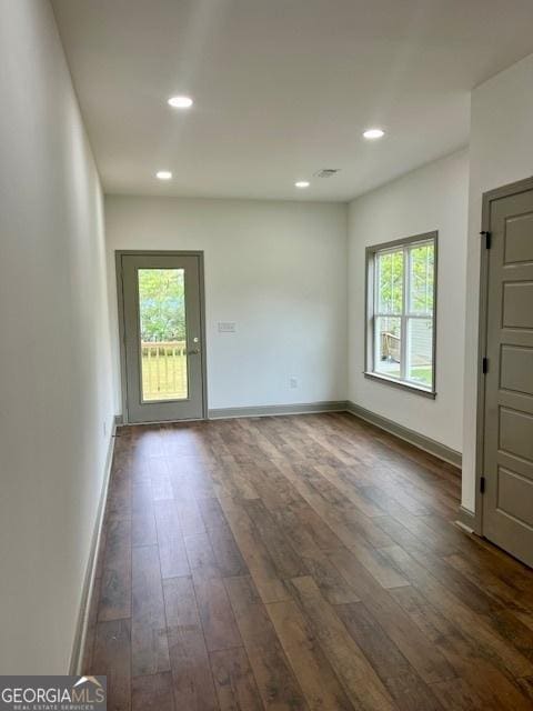 interior space with recessed lighting, baseboards, and dark wood-style floors