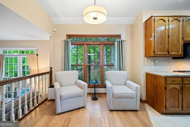 3376 Hickory Ln, Powder Springs, GA 30127 - sitting room with plenty of natural light and light wood finished floors