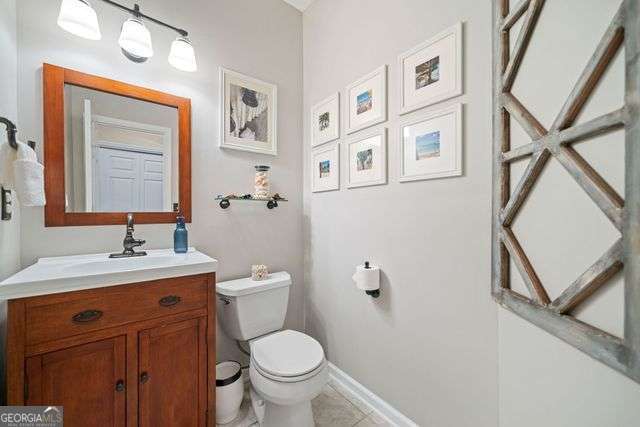 3376 Hickory Ln, Powder Springs, GA 30127 - bathroom featuring toilet, tile patterned floors, baseboards, and vanity