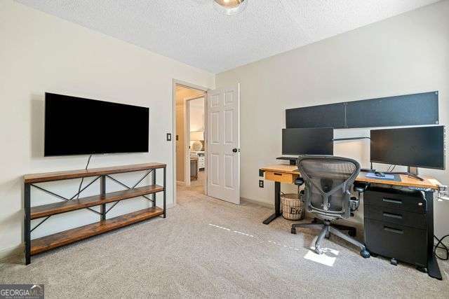 3376 Hickory Ln, Powder Springs, GA 30127 - home office with carpet flooring and a textured ceiling