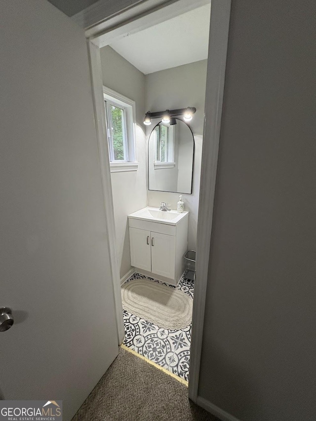 bathroom featuring vanity and baseboards