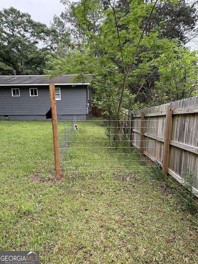 view of yard with a fenced backyard