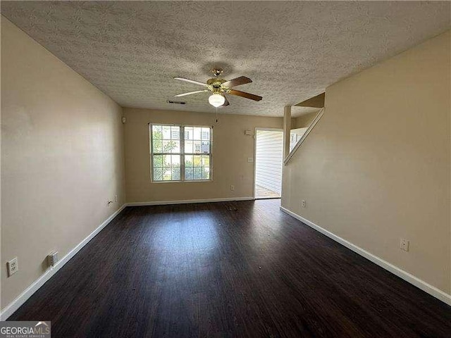 5280 Tussahaw Xing, Mcdonough, GA 30252 - spare room with baseboards, a textured ceiling, ceiling fan, and wood finished floors
