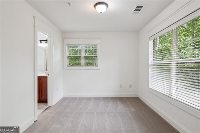 655 Mead St SE Unit 58, Atlanta, GA 30312 - empty room featuring light carpet, baseboards, and a pendent fire sprinkler