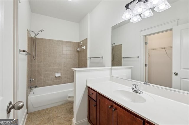 655 Mead St SE Unit 58, Atlanta, GA 30312 - bathroom featuring vanity, washtub / shower combination, toilet, and a spacious closet